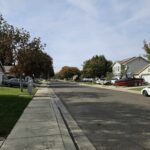 A suburban road in the fall.